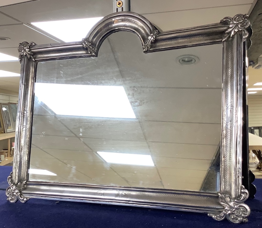 A 19th century Spanish engraved white metal mounted easel mirror, maker's mark, Espunes, Madrid mark, 1868, width 45cm, height 35cm.